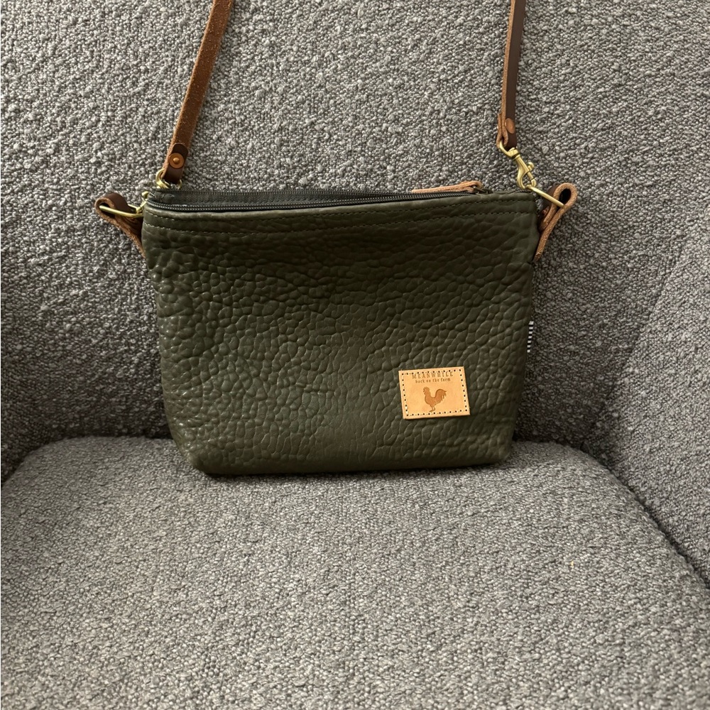 Meanwhile Back on the farm sling bag. Olive green with back suede pouch